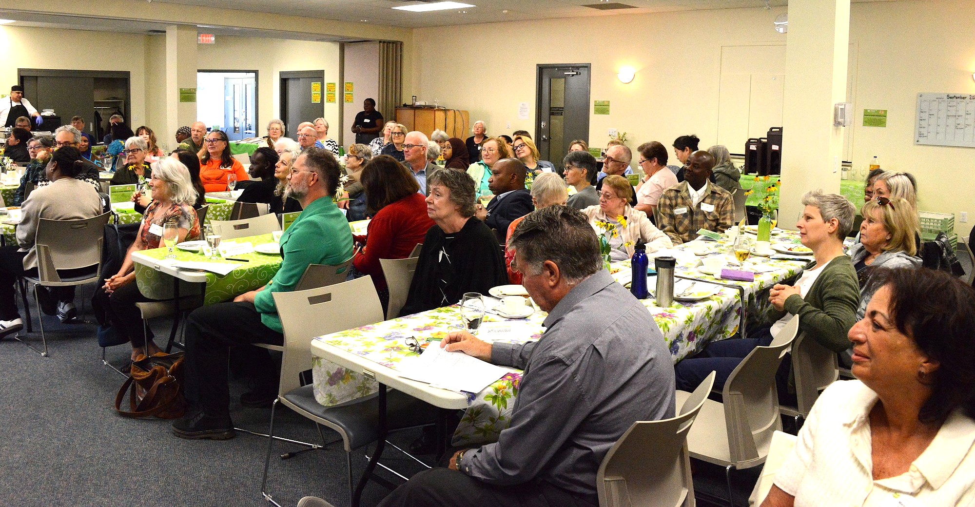 photo of the room. attendees sitting at tables